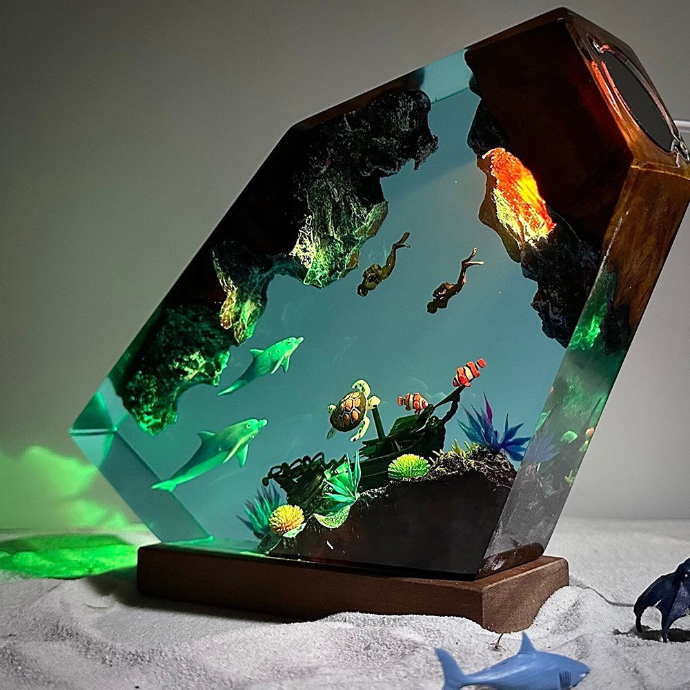 Orca — Ocean Diver Resin Night Light — hand-poured resin lamp glowing on a wood base