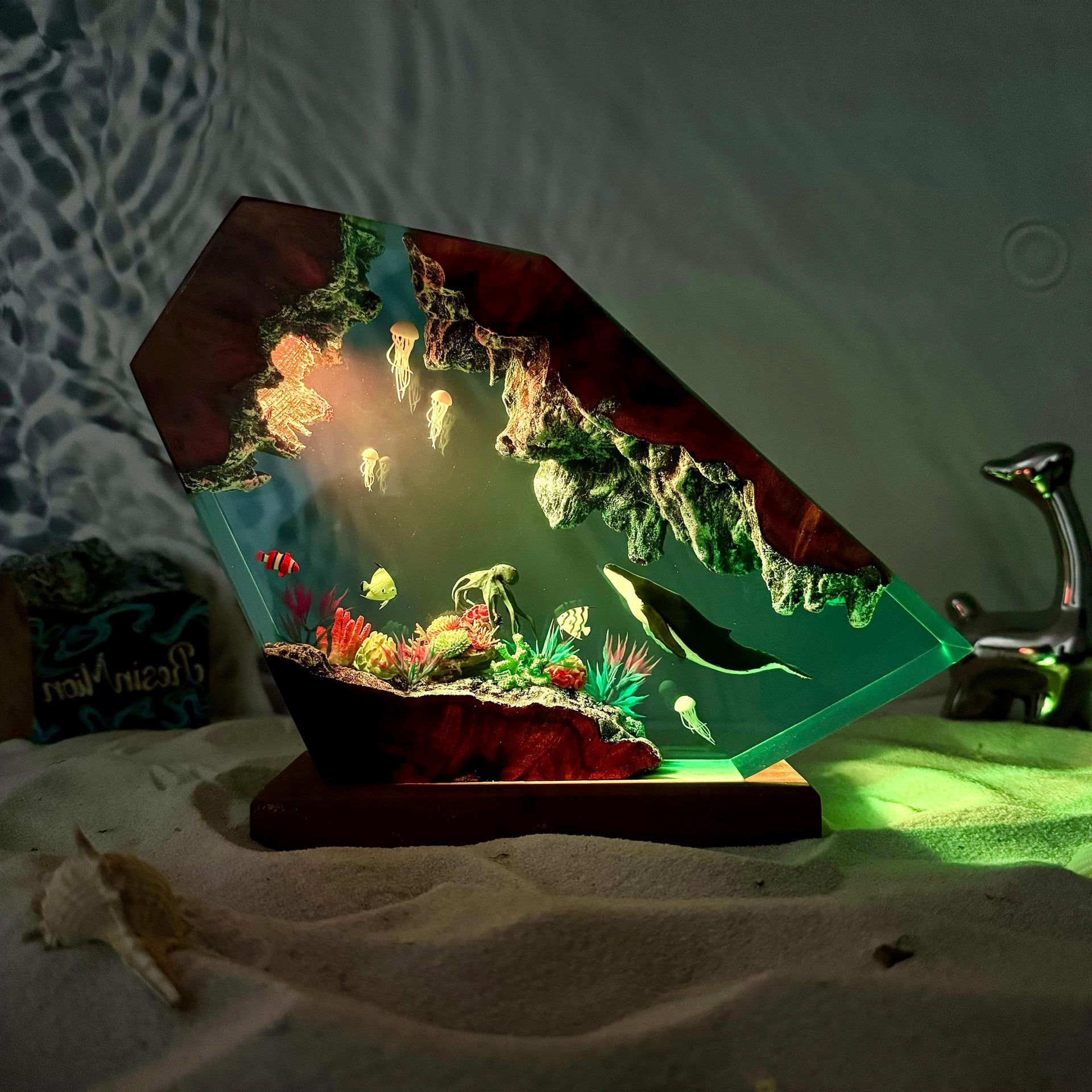 Mareluna — Whale & Jellyfish Resin Night Light — hand-poured resin lamp glowing on a wood base