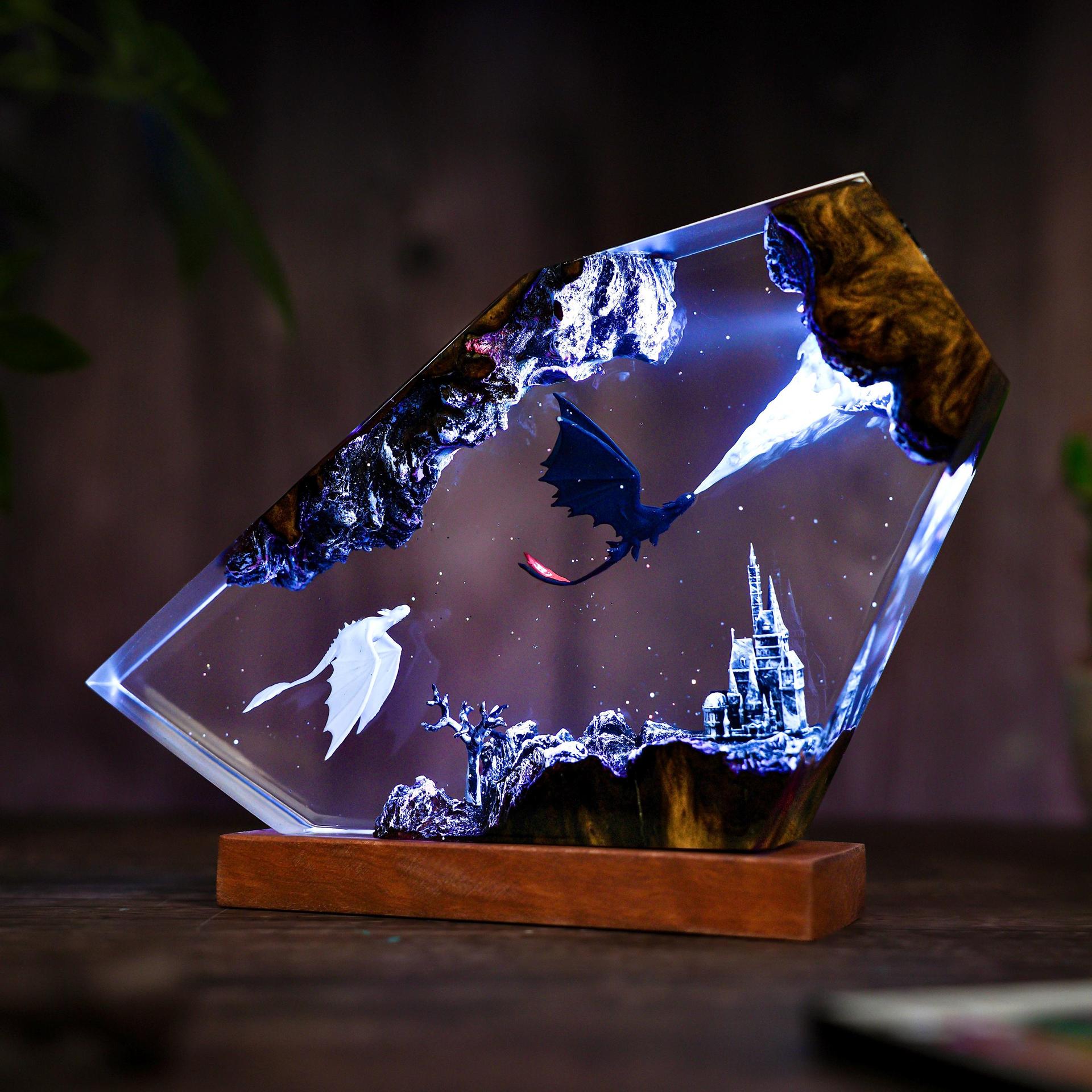 Stargazer — Dragon Duo Resin Lamp — hand-poured resin lamp glowing on a wood base